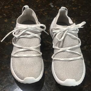 Gray Adidas tennis shoes.